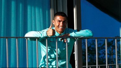 Photo of Cristiano Ronaldo in high spirits despite positive Covid test as he gives the thumbs-up while watching Portugal team-mates train from his balcony in Lisbon camp